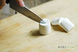 Cut a mini-donut in half and place this on the Swedish fish. You can also use a large marshmallow instead