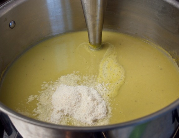 Return the soup to the pot and stir in the fresh lemon juice and grated Parmesan cheese.