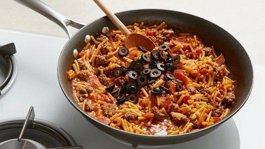 3 of 3
Add olives; stir gently to mix. Arrange pepper strips over top. Sprinkle with cheese. Remove from heat. Cover; let stand 3 to 5 minutes or until cheese is melted.