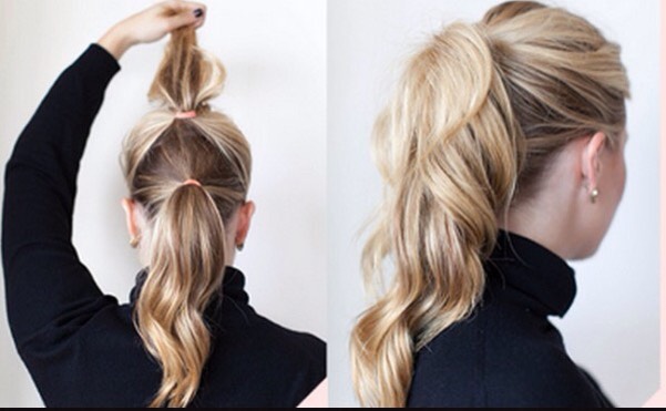 Create an illusion of full, lustrous hair by wearing both a high and a low ponytail at the same time.