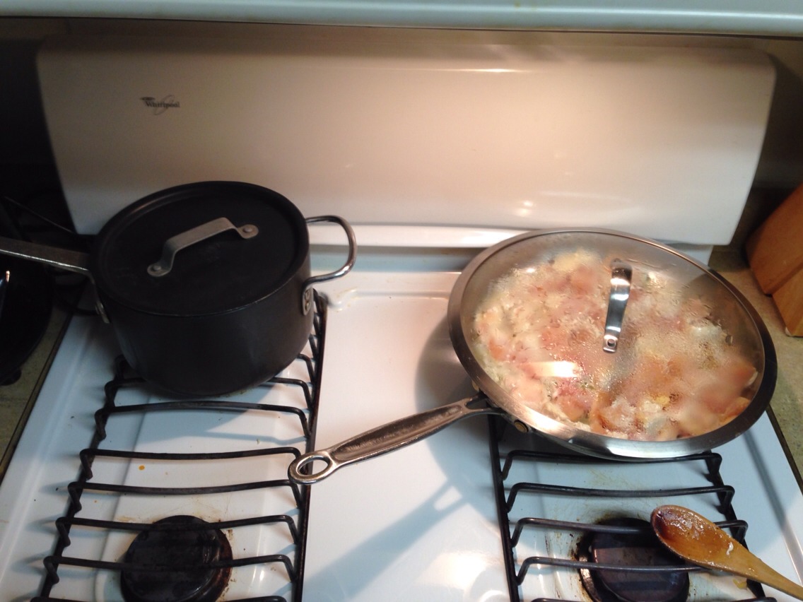 Cover both the rice and the chicken, stirring occasionally.