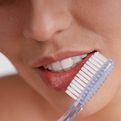 Next grab a toothbrush and brush your lips like you would brush your teeth (I suggest using a new toothbrush and not the one you use for your teeth).