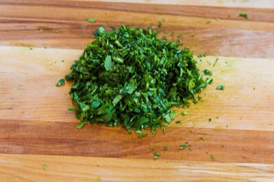 You also want at least 1/2 cup finely chopped fresh cilantro.  (We chopped the cilantro very fine so the cilantro flavor would be all through the salad, but you could chop it coarser than this if you prefer.)