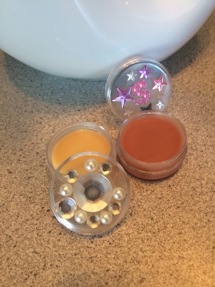 When your mixture is completly melted, let it cool down a bit  for about 2 minutes, then add your favorite essential oil and then you can pour it in small jars I bought those at Michael's, they're usually used for beads but are perfect for lip balms!