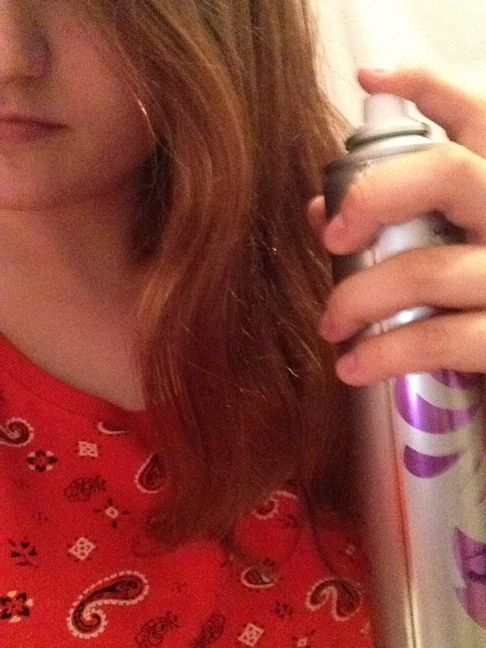 Spray the ends generously with hair spray