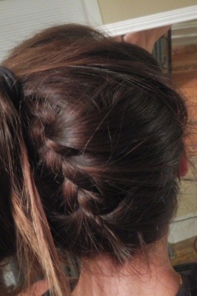 The Bajo Braid
Try this hot-weather godsend. Spanish for "under," this inventive hairstyle is ideal for short hair or layers that stick to your neck in the summer months. For best results, pair it with a high pony or bun.