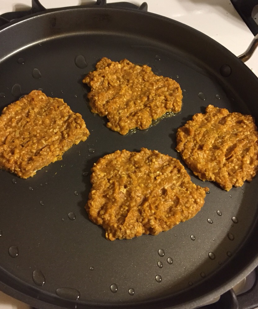 Heat a nonstick skillet over medium heat.  Spray with nonstick spray.  Once skillet is hot, create 4 pumpkin pancakes as best you can.  They don't need to be pretty in shape.  Cook aprox 3 minutes on each side.
