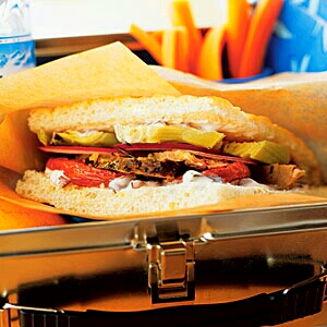 Lamb, Roasted Tomato, and Artichoke Sandwiches with Olive Spread
Roasting the tomatoes makes them sweet and meaty; it also draws out much of the liquid so that you can assemble the sandwiches the night before without worrying about the focaccia becoming soggy. Pair with crunchy carrots.