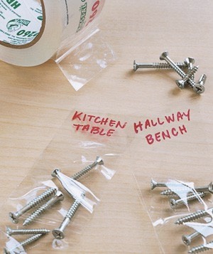 Gather loose bolts and nails in the garage by sticking them to a length of tape and layering another piece of tape on top.