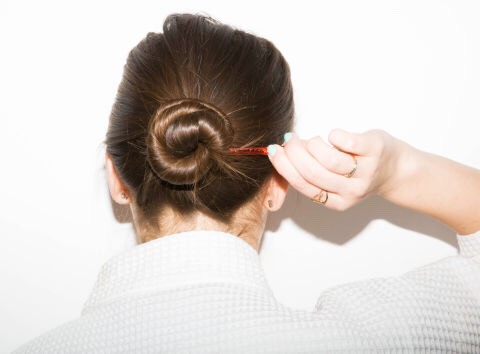 If you've washed your hair but don't have the energy to blow it dry, loosely twist your hair into a low bun, secure with a clip, and go about your life.