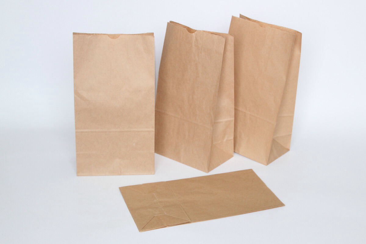 Cut two square pieces out of the bag that will completely cover the grease stain you are trying to remove.