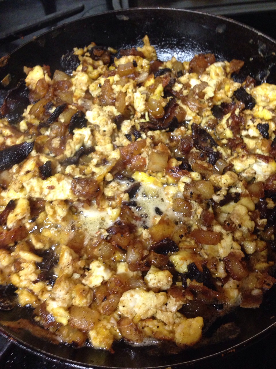 Cook up your favorite breakfast mix. I used peppered bacon, cheesy eggs, potatoes, cheese, and picante.