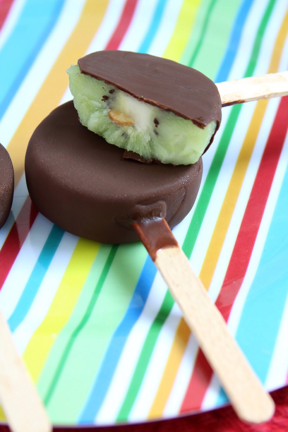 Kiwi lollipops ! All you need is a kiwi a stick and dark chocolate. Simply dip the kiwi slices into dark chocolate, place on the stick and freeze voila a yummy healthy summer treat :)