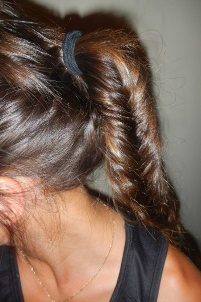 Get this look by separating ponytail into two even halves. Holding the right half, wrap a pinkie-width segment of hair from the outside of the left half to the outside of the right half. Alternate to the end of the ponytail.