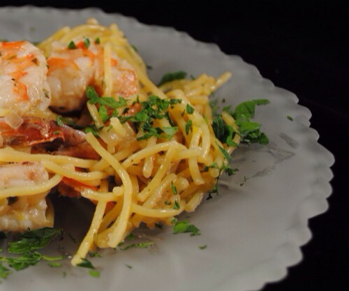 Cook shrimp til almost done. Add the 1 cup water and bring to a simmer add squeeze of lemon juice and let reduce by half.

Remove from heat and stir in butter.

Add shrimp and sauce to pasta, mix well serve pasta with fresh parsley and Parmesan cheese if desired.