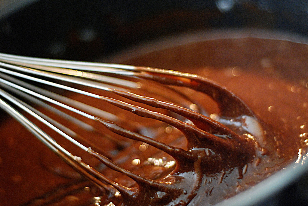 Step 1: In a medium bowl, mix together cocoa, white sugar, and vegetable oil. Beat in eggs one at a time, then stir in vanilla. Combine flour, baking powder, and salt; stir into cocoa mixture.
