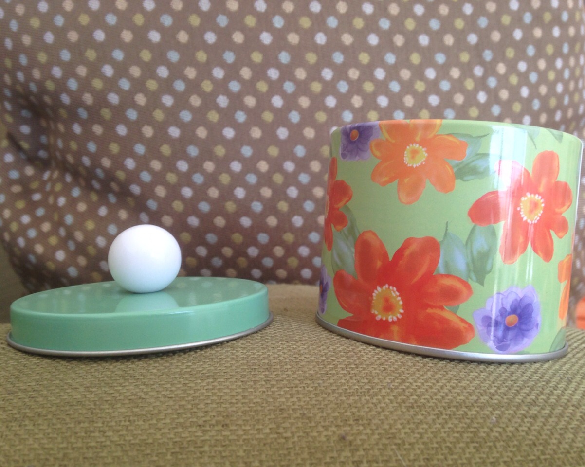 Get a small little tin, you can get some cute ones like this at the dollar store. 