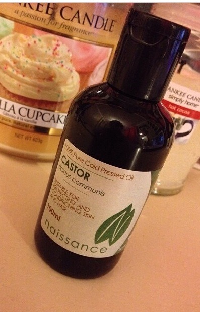 put a little bit of castor oil into your small container, you only need about 1-2 tablespoons depending on how long your hair is. 