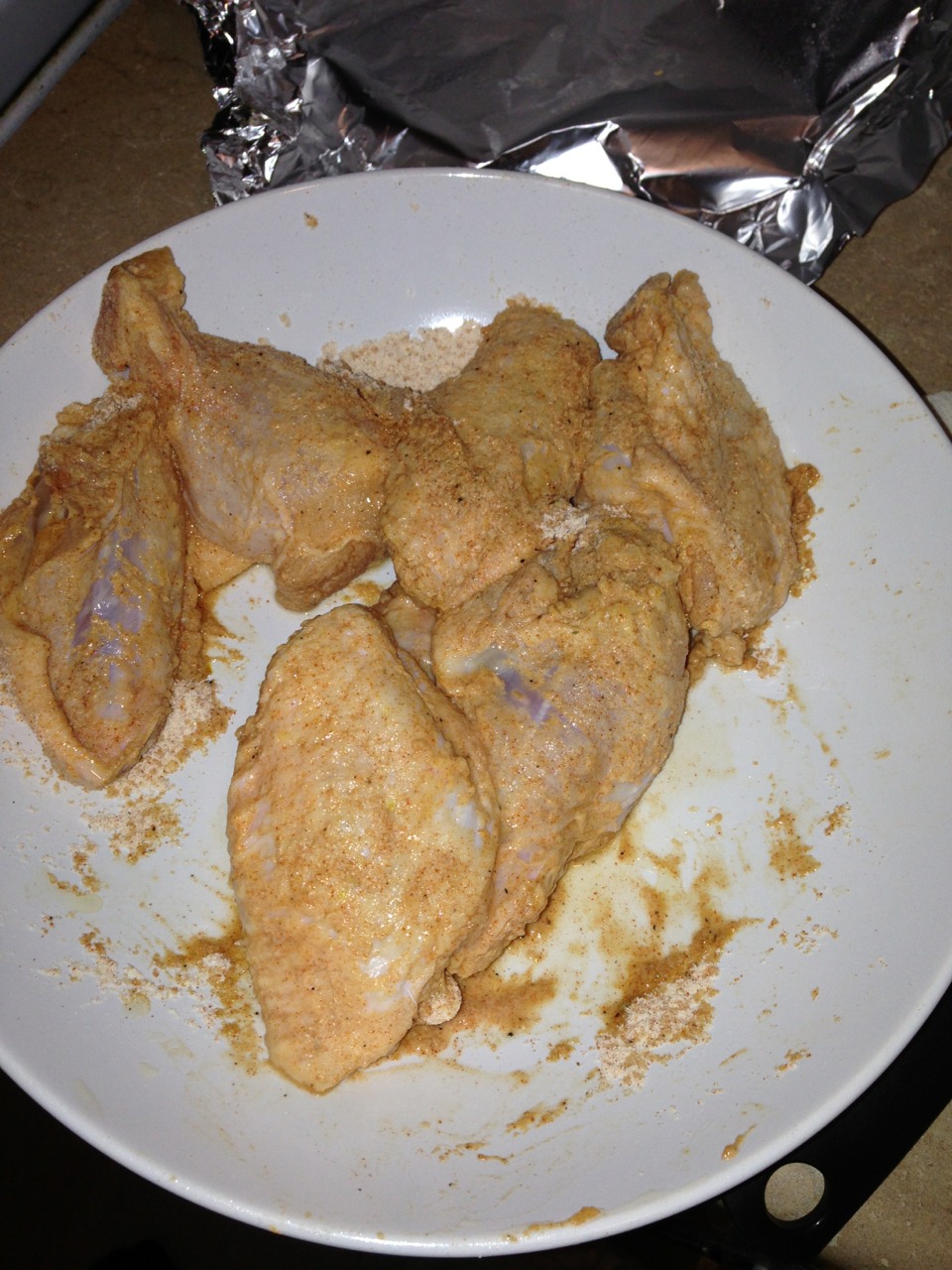 Put chicken wing in the flour mixture cover the chicken in it the shake them to remover any excess of flour place chicken wing in a plate and put it in the fridge for around 1-2 hours  