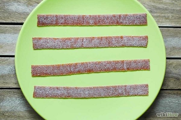 Place a strip of Fruit by the Foot (or a thin strip of Fruit Roll-Up matching the length of a Fruit by the Foot) on your working space.