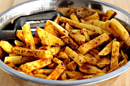 11. Sprinkle the spices over the potatoes and toss well to coat.