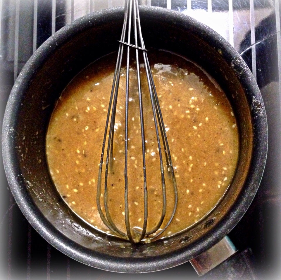 Next, mix the brown sugar, Ginger Sesame Dressing, 1 stick of butter, pepper, & Garlic n' Herb spices (or Garlic Salt) stovetop at medium heat until it has a molten consistency. Place the wrapped asparagus on a pan (spray with cooking spray) and drizzle the glaze on with a spoon.