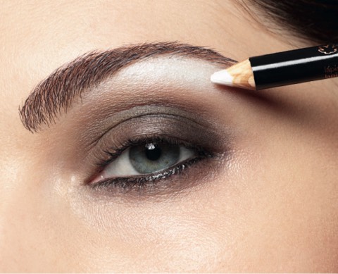 Step 6: Highlight Your Brow
Take the same light eyeshadow and dab it on your browbone, concentrating on your mid-brow outward. Blend with your finger.