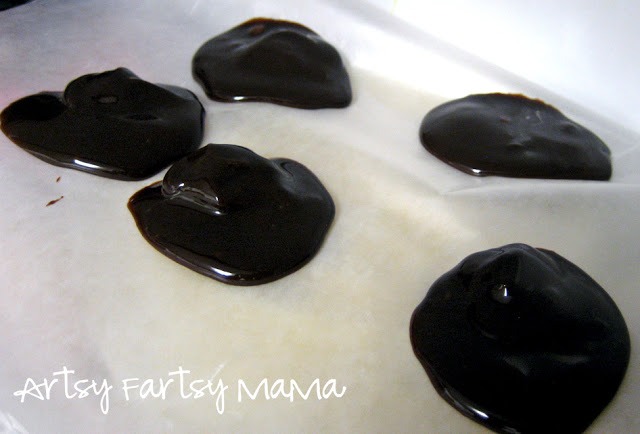 For the "chocolate filling", I globbed spoonfuls of refrigerated hot fudge (not hot) onto some wax paper and placed in the freezer.
**Just FYI, hot fudge doesn't freeze. It just gets really cold and stiff. So, place in the freezer as soon as you can after placing on the wax paper, it melts fast