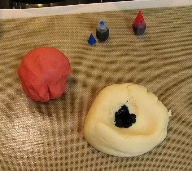 Make a divot in the center of the ball, and drop some food coloring in