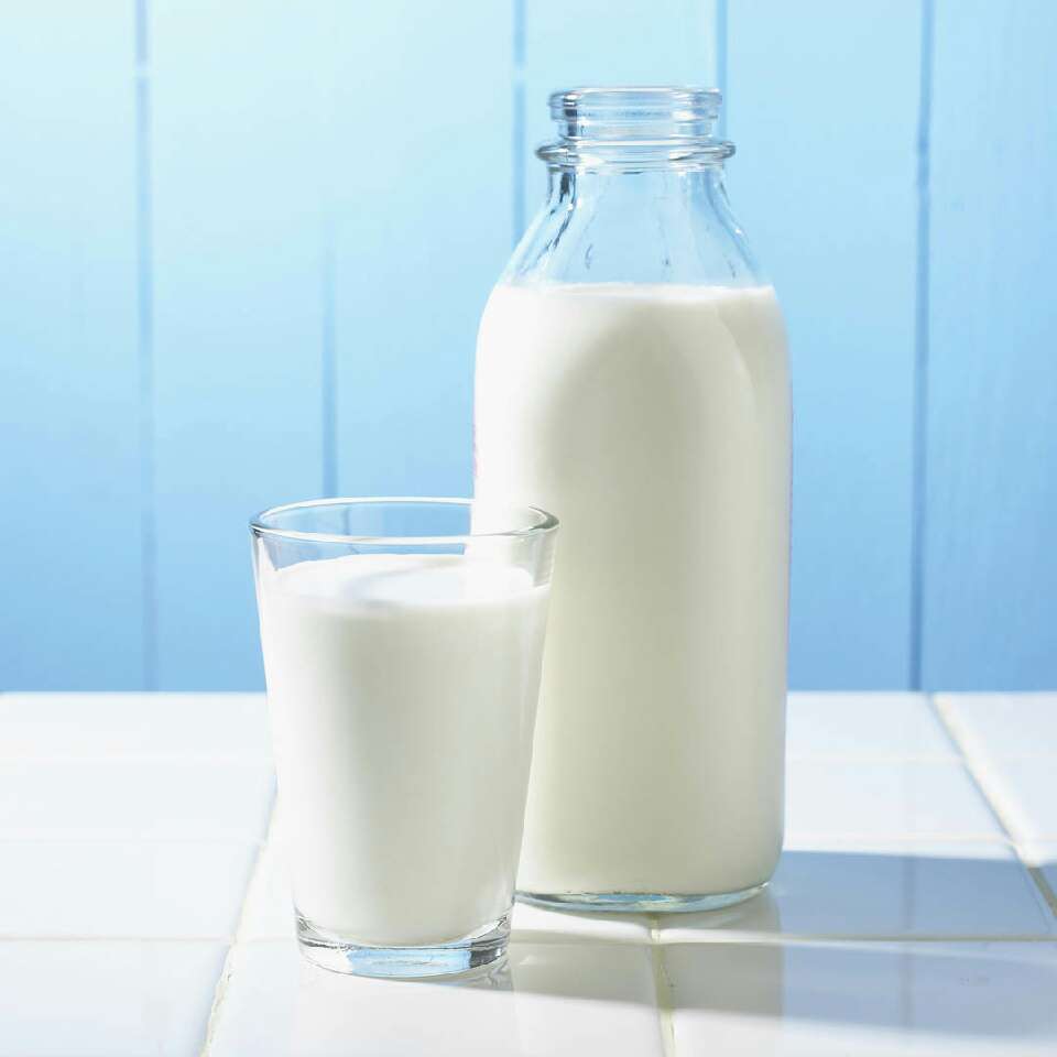 Next you'll need a half cup of milk. Mix the egg yolk and the milk together thoroughly. 