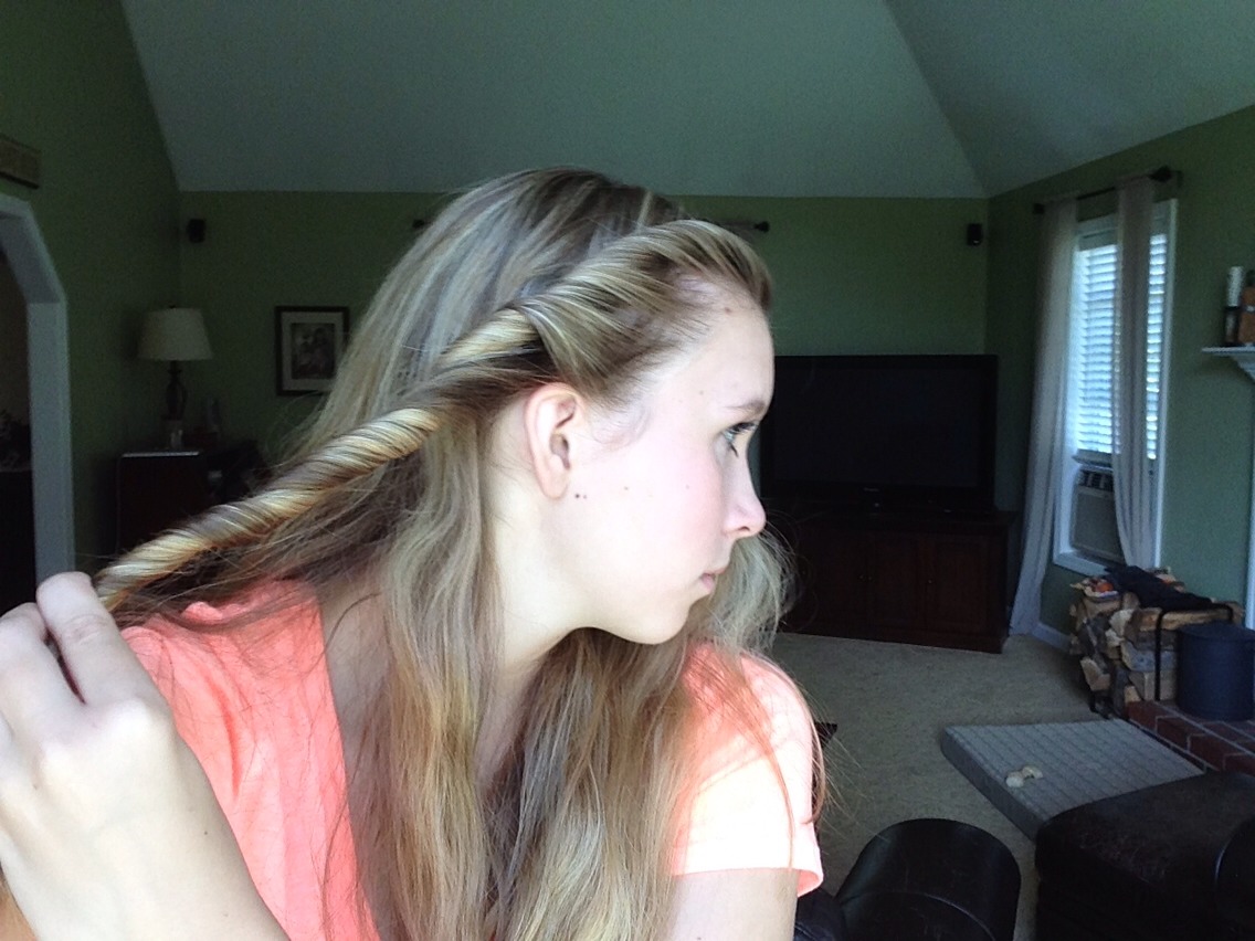 Continue doing this until you reach the hair behind your ear, not leaving much hair loose on that side of your head.