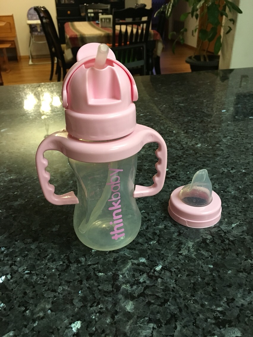 This drink container by Think Baby is spill proof. You can buy it either with a straw or a silicone sip tip. I got both.
I got mine on Amazon.
