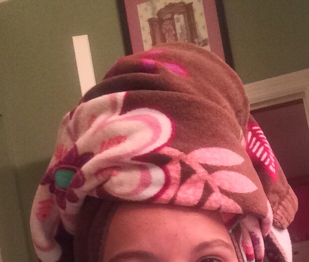 Step 4: Wrap your hair in the warm towel and leave it like that for 15 min. 