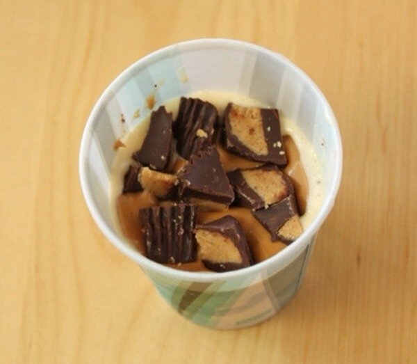 Top off with peanut butter cups and one last layer of ice cream. 
