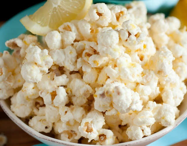 Preheat oven to 275 degrees. Allow coated popcorn to dry at room temperature, about 10-15 minutes, then drizzle lemon juice over popcorn and toss well to evenly coat. Spread popcorn onto a rimmed cookie sheet and bake in preheated oven for 15 - 20 minutes until lightly golden.