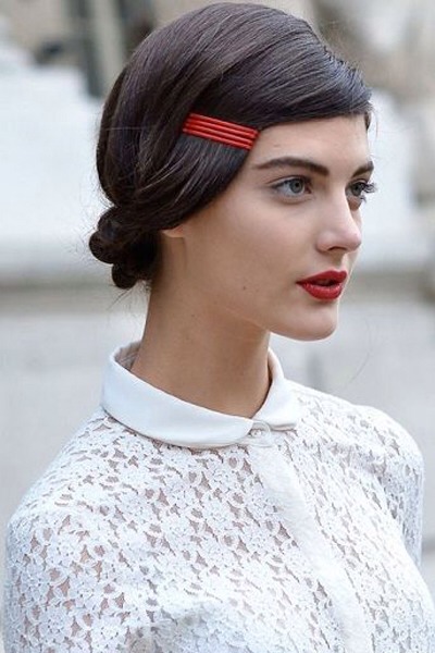 This updo may be sleek, but colorful bobby pins at the hairline will work with any style—a fishtail braid, a messy bun or even loose waves. Match the clips to your lips for added oomph. 

