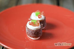 Cut some small pieces of licorice or twizzlers so that they look like fish eggs and place them around the jelly bean half.