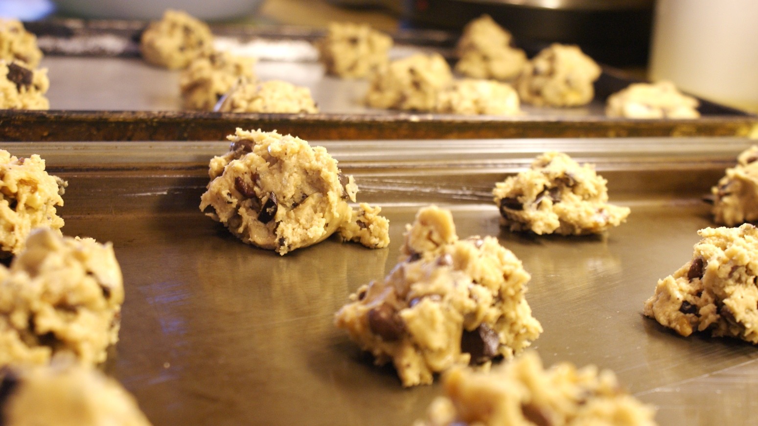 Add in flour. The mixture is going to be crumbly at this point. 

Add in 2 tablespoons of milk and mix. Now the dough will look like the cookie dough you’re used to seeing.