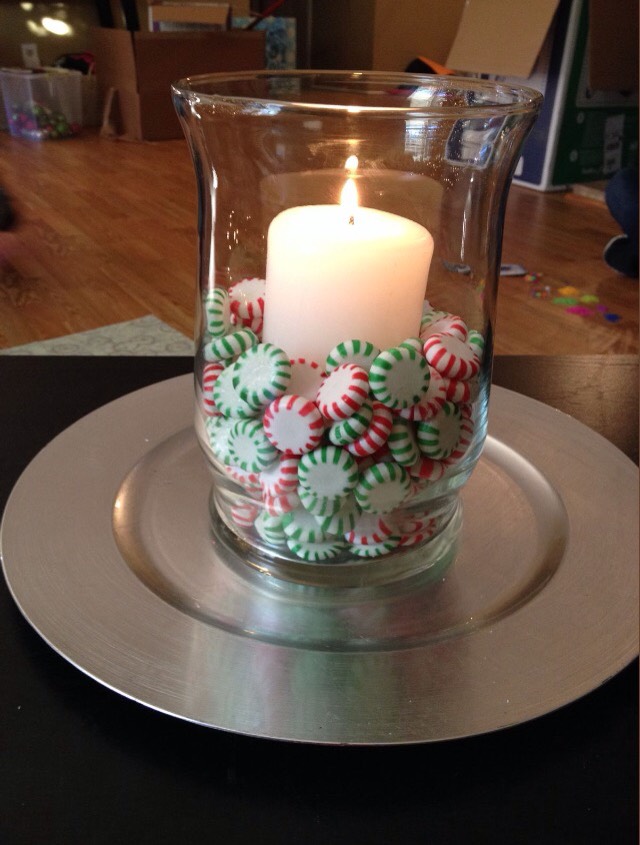 Simple! Get a glass jar or vase, fill with peppermint candy, and place candle in the center of the vase.