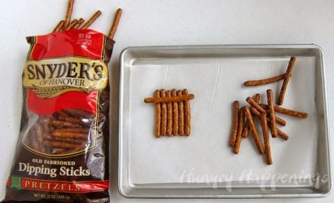When you open your bag of Dipping Sticks. you will find various pretzel lengths. I found it best to put 6 pretzels of similar size together for the snowman head, then find one that was longer for the brim of the hat. 