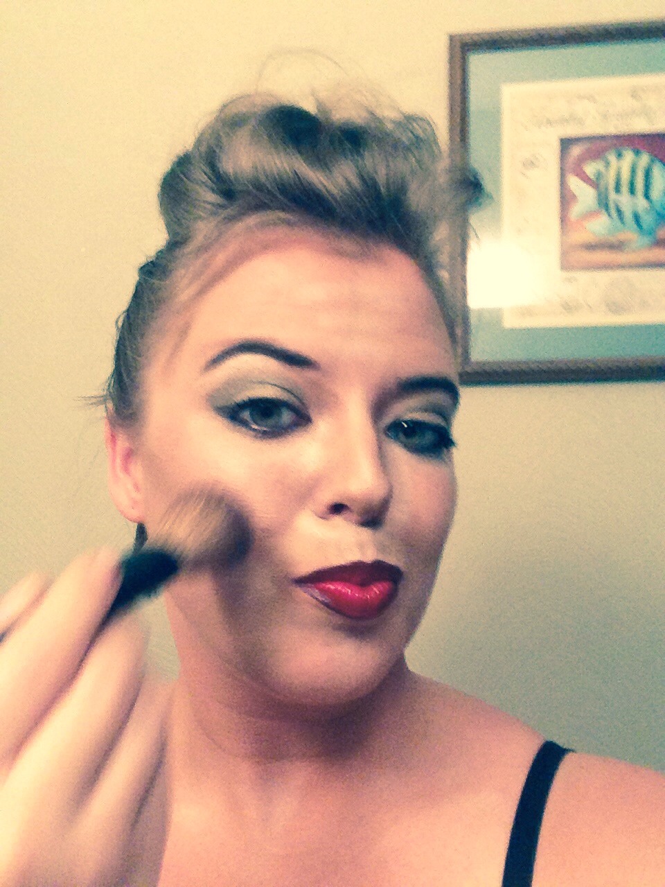 Now blend the highlighter and bronzer using small circular motions. 