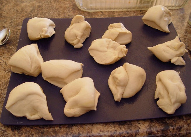 9. Take a sharp knife, spray it with cooking spray and cut your dough into 12 pieces. Make them as equal as you can….perfection is not necessary. What a relief.
