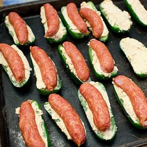 Depending on the size of the smokies, you may need to cut them in half or quarters. The smokies that I used are cut lengthwise and fit perfectly on the jalapeno pepper.
