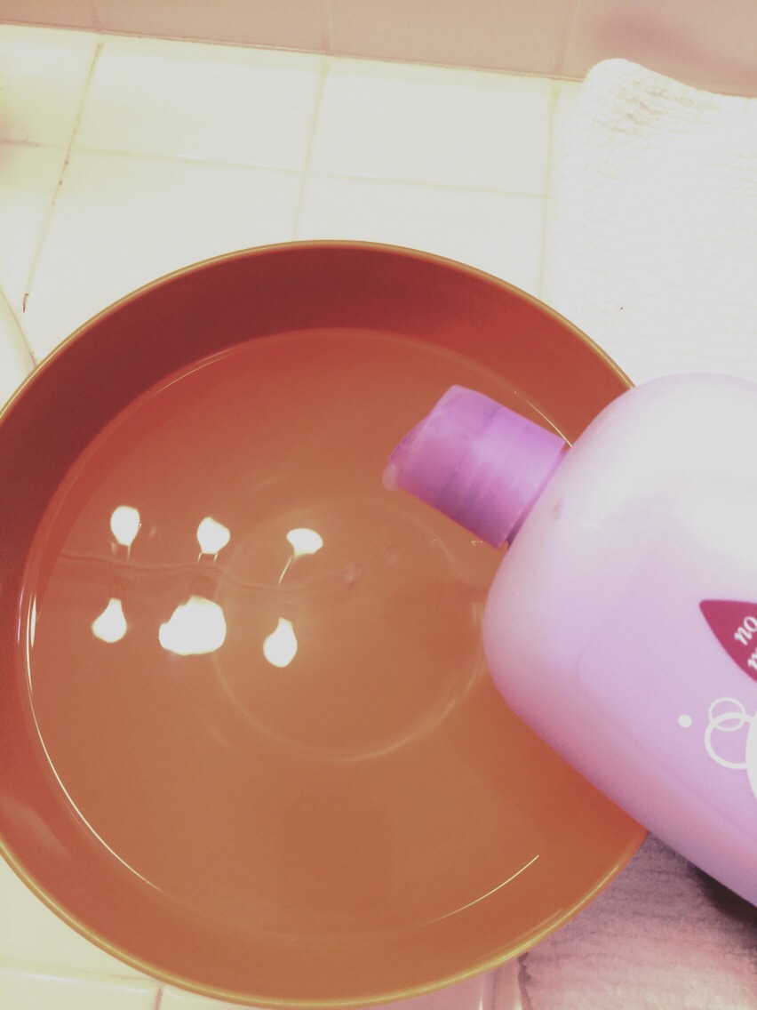 Fill a bowl with warm water and add a little bit of baby wash or baby shampoo. What's great about this stuff is that it's gentle but can still get the job done. Don't use dish soap or hand soap because it can be too harsh On the brushes over time.