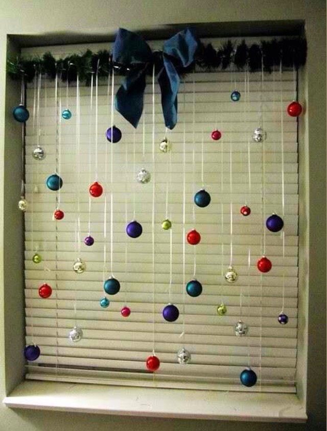 Hang baubles from string, and hang from window.