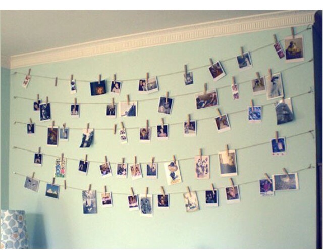 Hang pictures up on strings with clothes pins 
