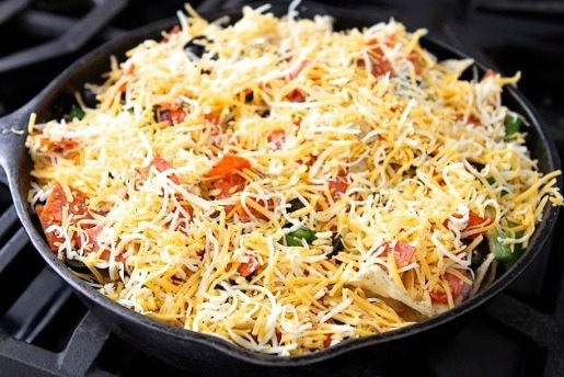 Step 10: Finish the nachos off by adding the Colby Jack cheese.