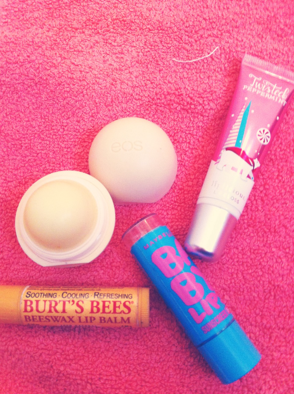 Keeping your lips moisturized is key. So any Chapstick, lip balm, or lip gloss is nice to have. I carry my EOS, Baby lips, and Burt's bees with me at all times
