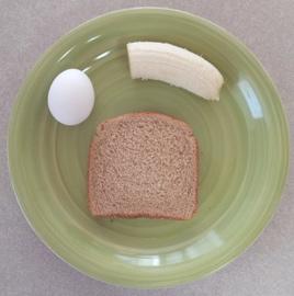 Day 2 Breakfast:
(1) hard boiled egg (78 calories)
(1) slice of toast (67 calories)
(1/2) banana (53 calories)
You may substitute (1) scrambled egg in place of the hard boiled egg. Try not to use salt or other additives.