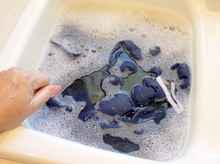 Let the item soak in the baby shampoo water and gently work it through. This will relax the fibers in the clothing.